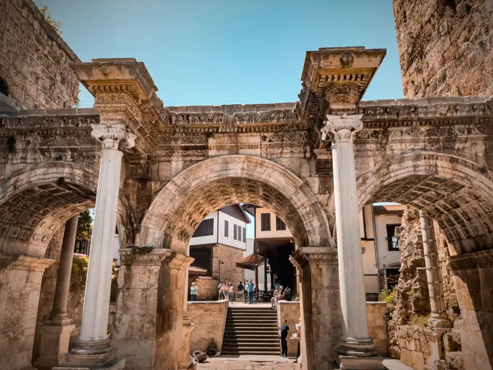 Illuminated historic stone alleyways in Old Town filled with outdoor tables and evening nightlife