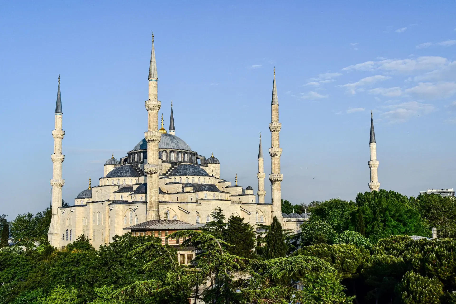 The historic exterior of the Blue Mosque in Istanbul showcasing its grand domes and minarets