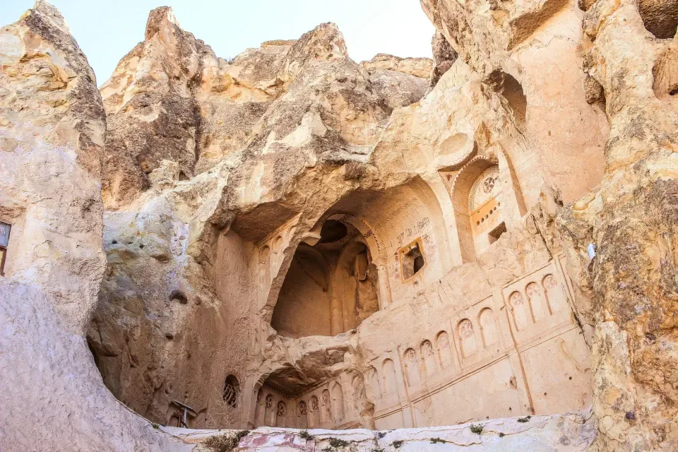 The volcanic rock formations and cave openings of the historical monastic complex in Goreme