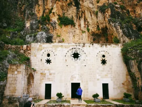 Gothic stone arch facade of the Cave Church of Saint Peter carved into Mount Staurin cliffside in Hatay