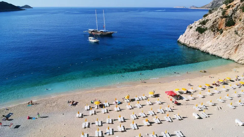 A beautiful beach and a gulet on the Turkish Aegean coast