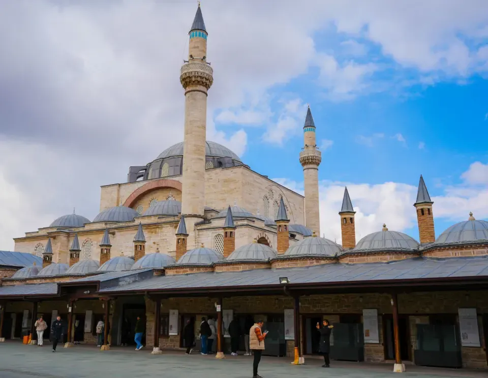 The historic exterior courtyards of the Mevlana Museum complex in Konya