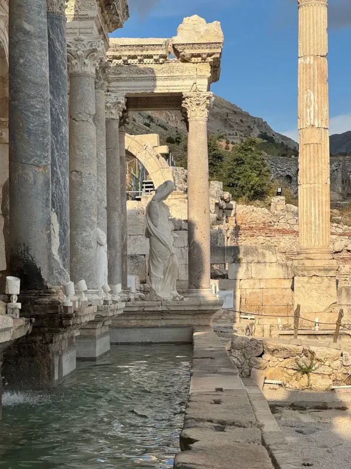 The restored Antonine Nymphaeum fountain with flowing water