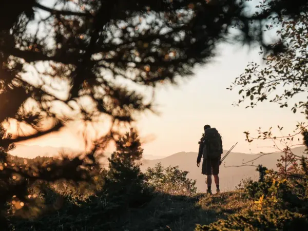A hiker walking along a trail