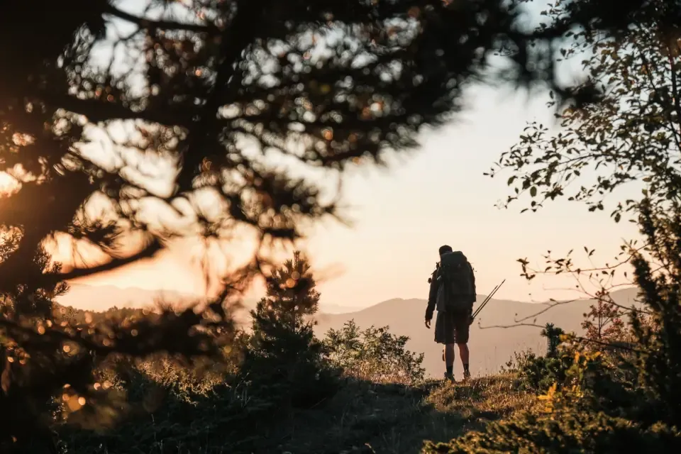 A hiker walking along a trail