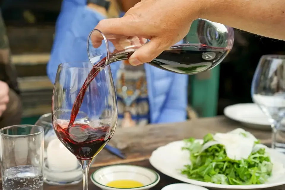 Spread of Aegean olive oil dishes, fresh bread and fruit wine in Sirince
