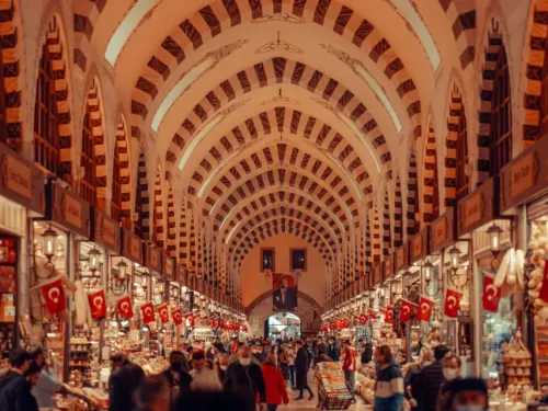 Interior corridor of the Spice Market in Istanbul lined with colorful mounds of spices and sweets