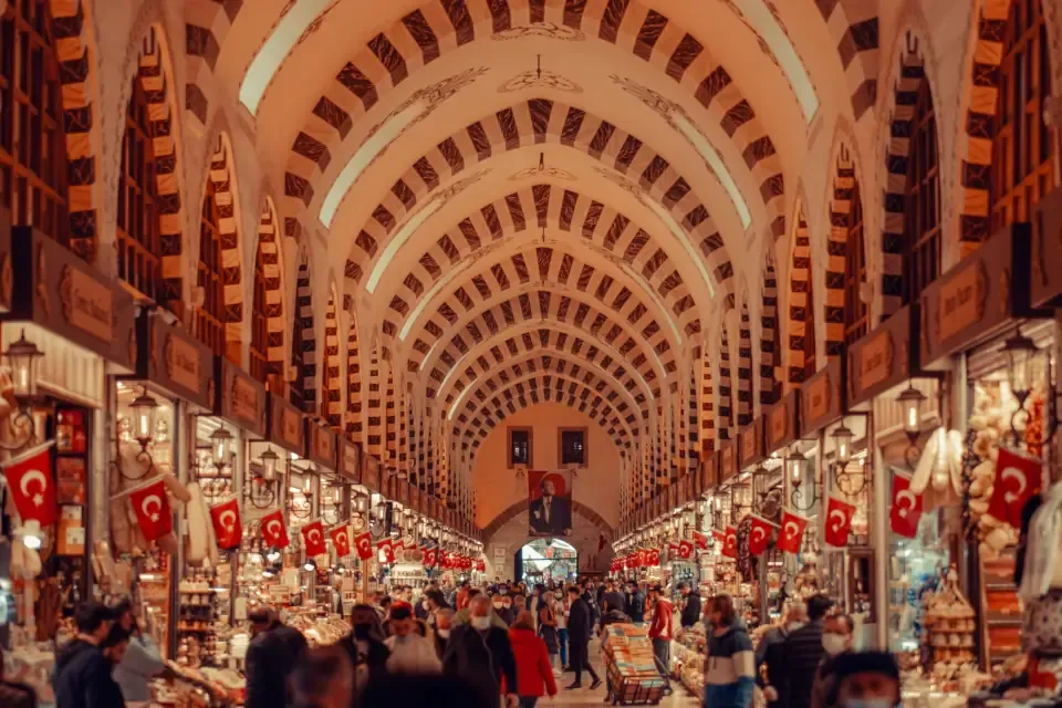 Interior corridor of the Spice Market in Istanbul lined with colorful mounds of spices and sweets