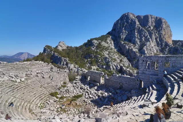 The ancient cliffside theater of Termessos overlooking deep mountain canyons