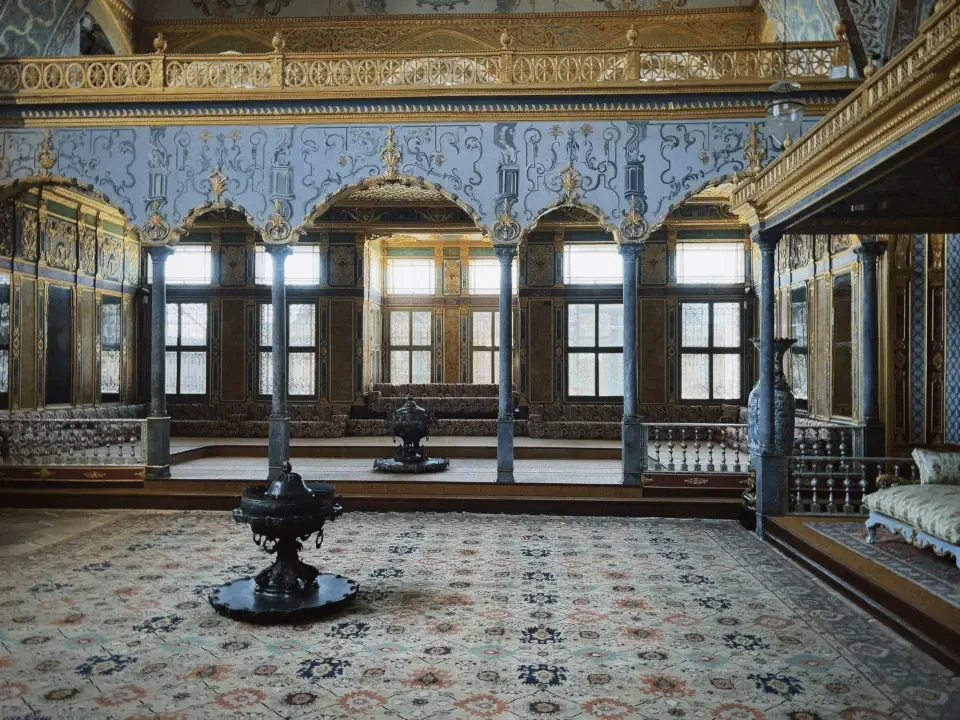 The richly tiled luxury hallways and golden arches inside the Harem wing of Topkapi Palace