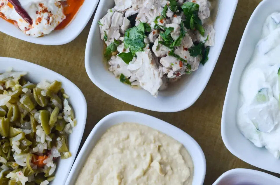 Farm to table Aegean dish with edible flowers and olive oil pairing