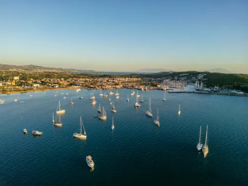 Boats in Sigacik harbor during a sunny day in Urla