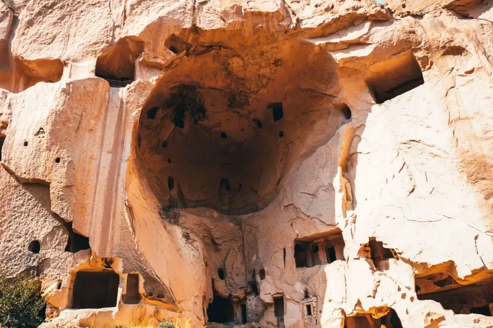 The rock cut monastery and cave rooms carved into the cliffs of Zelve's third valley